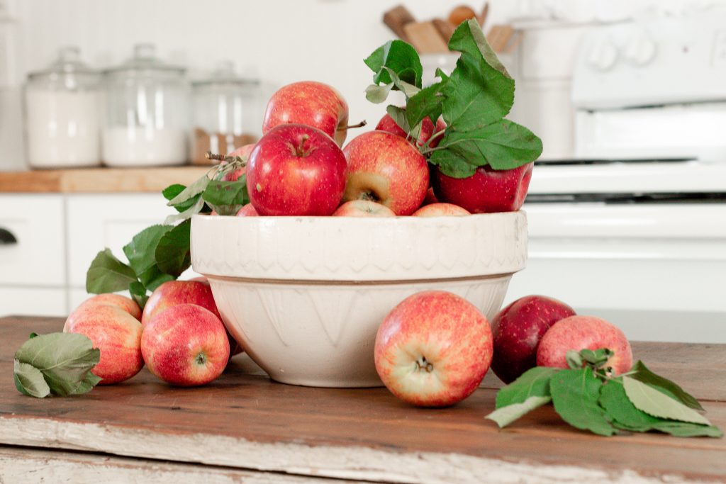 Fresh apples on farmhouse table