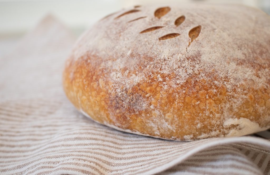 sourdough bread scoring details and golden crust