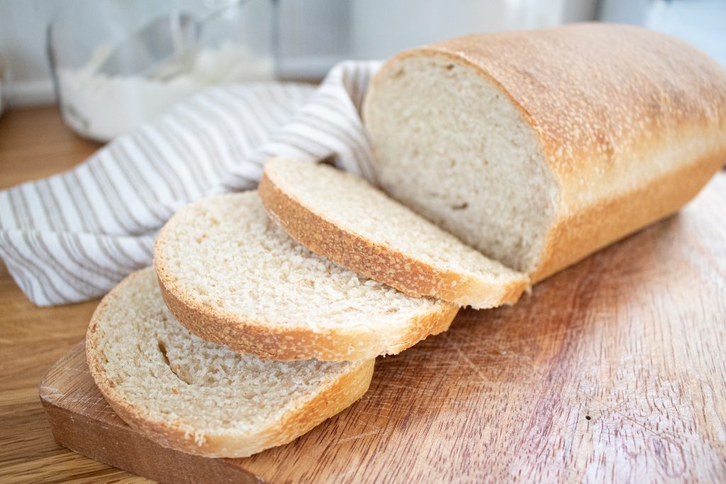 sliced soft sandwich bread on cutting board